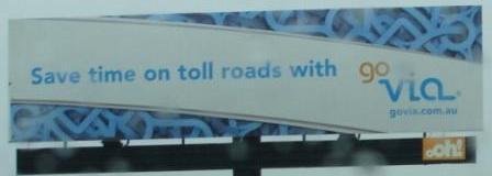 Billboards promoting the travel time benefits of toll roads were