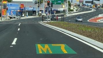M7 in gold lettering on a green background.
