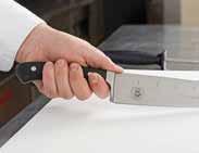 C Grip the knife by placing three fingers on the bottom of the handle, the index finger flat against the blade on one side, and the thumb on the other side.