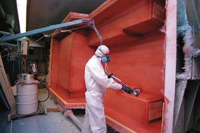 NEW FACTORY 1 After a layer of Gelcoat is applied to the interior of the mold, a