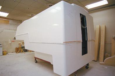the Gelcoat to form a very rigid, strong and light weight molded shell.