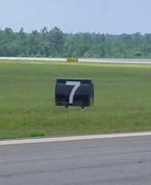 Examples of airfield signage. 2.1.3.5 Other Taxiways Each parallel taxiway has a variety of right-angle taxiway connectors associated with them.