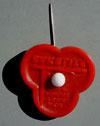 0 Lot # 267 - Bakelite Stick pin in red with the Trylon and Perisphere (Perisphere is a white bead) and the words "New York World's Fair" above and "Bakelite" below.