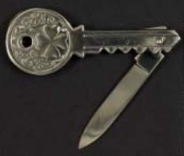 Shown here are a key with a tiny knife
