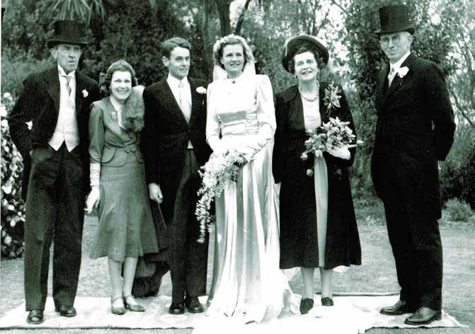 John and Eleanor (standing at the right) at the wedding of their daughter Jimmy to John Lockhart Clark-Hall (known as Pat) 7