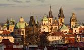 sunset with the panorama of Prague Castle and the Charles Bridge.