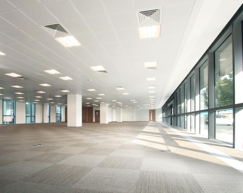 SPECIFICATION OPEN PLAN ACCOMMODATION SUSPENDED PERFORATED METAL CEILING TILES WITH RECESSED FLUORESCENT LIGHT FITTINGS.