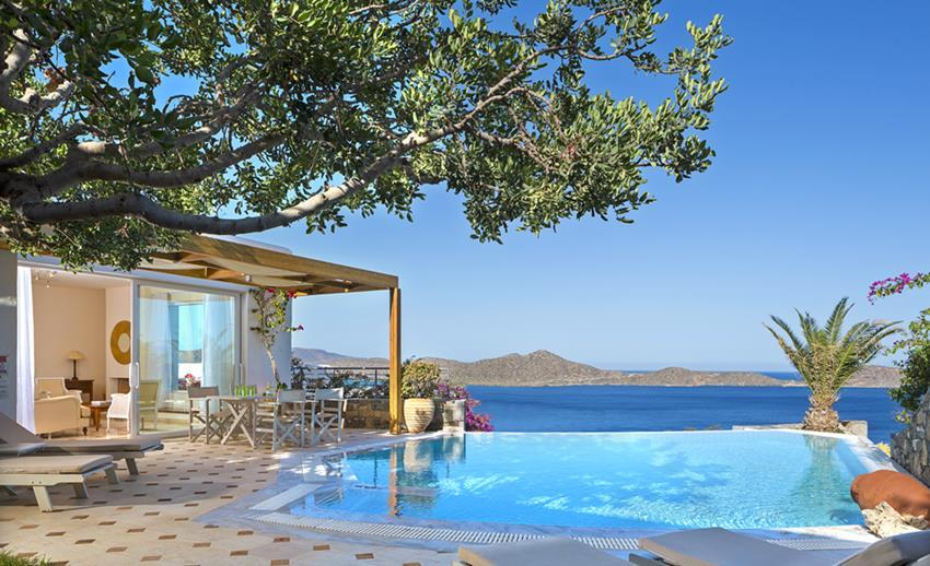 At the premises of a small and prestigious family owned and run, award winning Boutique Villa-Hotel, spread majestically across a small hillside overlooking the magnificent sapphire blue waters of