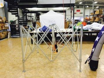Step 1 TO INSTALL CANOPY ONTO FRAME: Place your closed tent frame in desired location and expand frame half way.