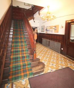 staircase and original tiled flooring.