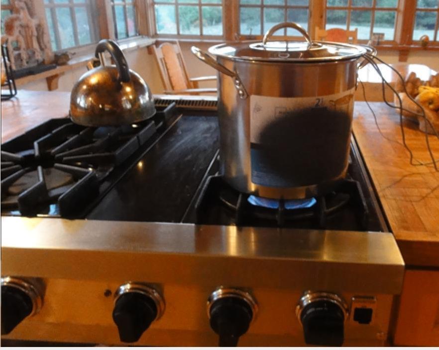 Pot on Viking gas stove. Trying to figure out why the Hunter could boil water faster than the Viking we hypothesized that the unenclosed flame might be part of the reason.