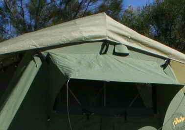 Place the tent flat on the floor with the mounting rails facing downwards before you continue.