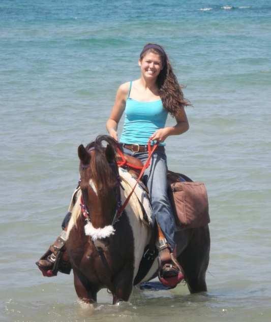 It was such a nice day and we ran our horses from the beach into the lake. My horse laid down in the water. While I was on him, Dani said.