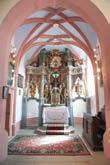 The chapel is an addition from 1750. The main altar from 1756 is a Baroque masterpiece from the Mersi workshop in Rogatec. It depicts Mary s Coronation.