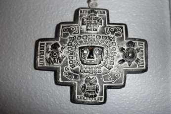 The cross that I found in Bolivia had four animal figures at the N - S - W - E cardinal points: