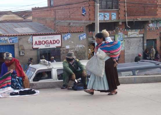 A Bolivian baby walking with a baby
