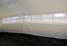The elastic webbing bands for the bottom of the walls are stitched to the tent in the seam where the PE and fabric are joined.