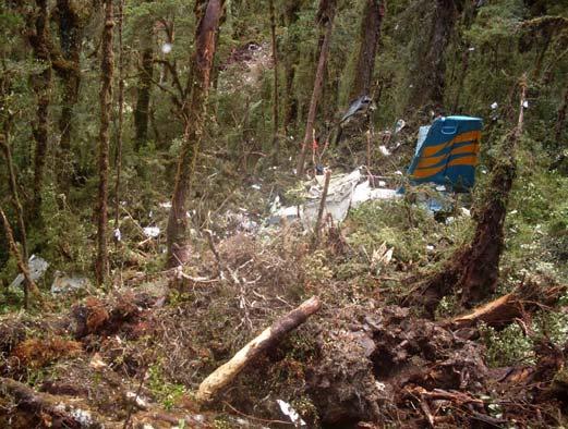 1.12 WRECKAGE AND IMPACT INFORMATION Figure 3: Wreckage of Twin Otter PK-NVC The aircraft struck trees, in a left banking turn, before it impacted the ground.