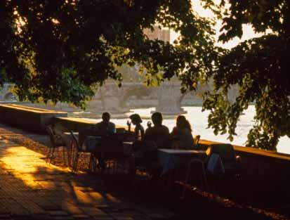 café patrons on the vardor river. below: lake ohrid, from the village of trpejca in Ohrid and not to be missed.