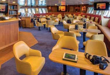 deck with chairs and tables, and LEXspa. Our open bridge provides guests an opportunity to meet our officers and captain and learn about navigation.