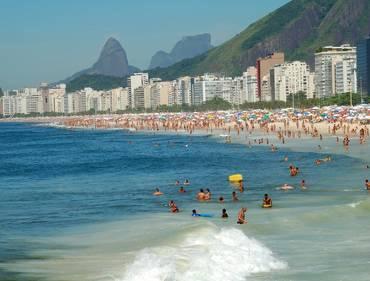 Head to the beach, take a dip in the warm ocean waters, join in or watch a game of futevolei,