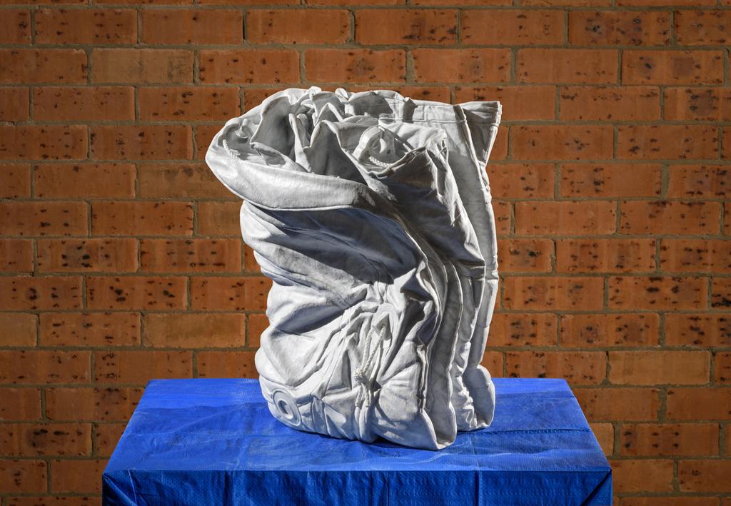Folded Zodiac 01, 2015 Bianca Carrara marble, tarp, rope, spigot 56 x 42 x 35 cm