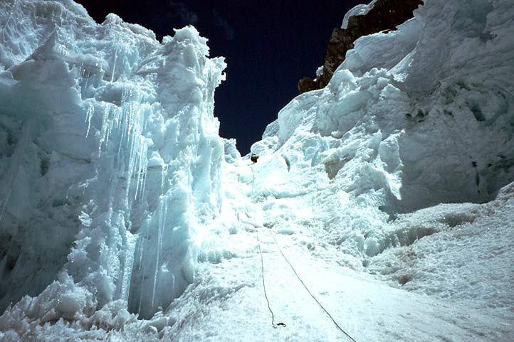 We cross the crevasse by another snow bridge, then continue to a steep bergschrund of up to 70 degrees and about 65m in length; this marks the start of the summit climb, and