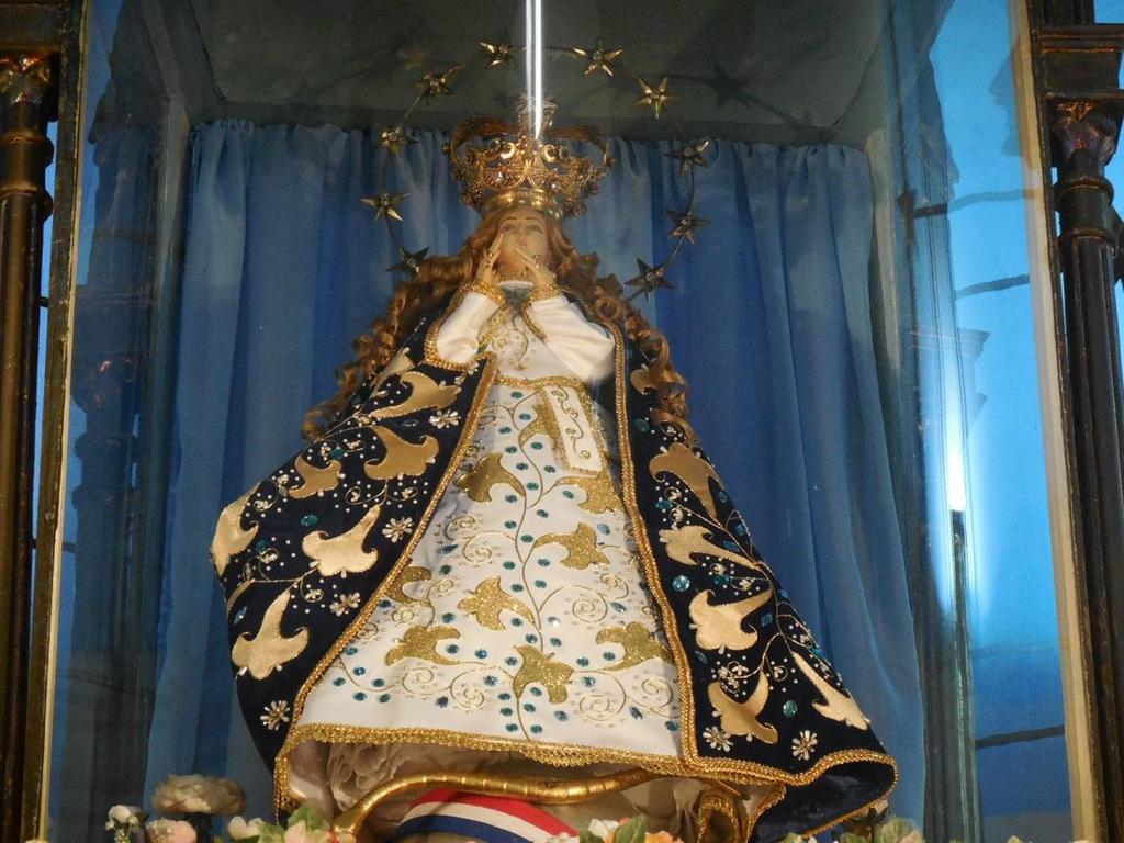 As I came closer, I noticed that the Virgin of Caacupe wore a blue (color of heaven) flowery robe, and