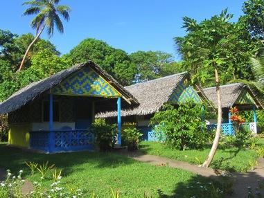 Uduna cove beach Bungalows This cluster of five brightly painted blue and