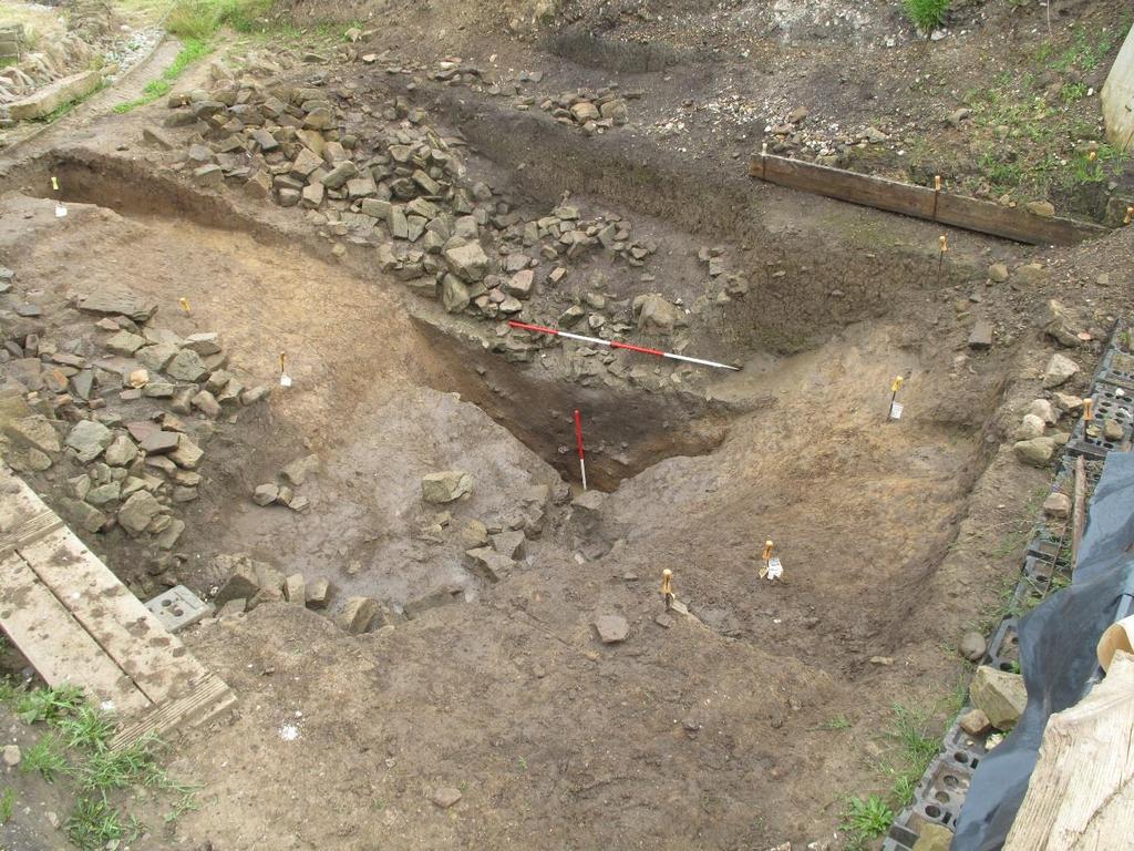 Image 5 Section through inner ditch of fort, remodelled in a sub-roman refortification of the site Tumbled material on