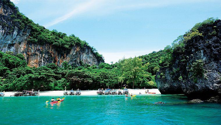 adorned long tail boats. With attractions including hot springs, a wildlife sanctuary, sea caves, flourishing coral reefs and exotic marine life, limestone cliffs that draw rock climbing enthusiast.