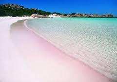 The sand appears pink because it is a