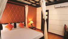 Rooms are spacious and air-conditioned and the beach is only a short stroll across the gardens.