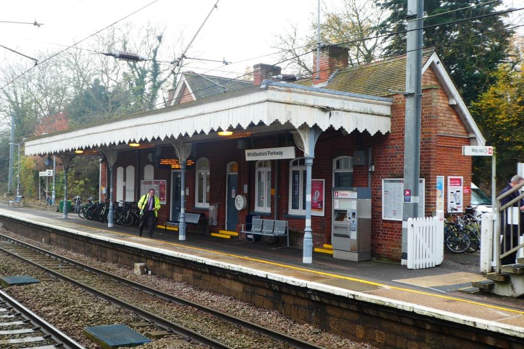 The station building canopy provides shelter on the down platform but the effective area is reduced due to