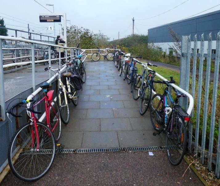 There are no cycle racks on the east side and cycles are left locked to the disabled access ramp and platform railings (adjacent to