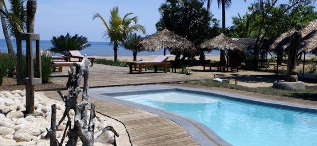 Nosy Lodge Nosy Lodge is an owner-run property situated on the western coast of Nosy Be Island, on a palmfringed beach surrounded by clear, turquoise waters and open to the soft sea breeze.