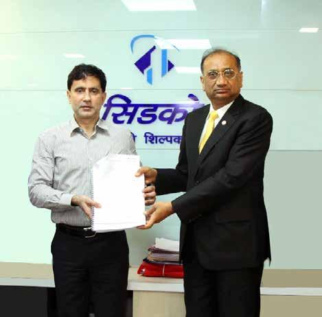 Jain CEO,GVK MIAL receiving the LOA from Mr Bhushan Gagrani, Vice Chairman and MD of CIDCO Mr R. K.