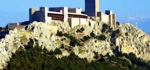 The Parador castle hotel towers over the historic city of Jaen, on the peak of Santa Catalina hill.