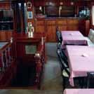 Formal air conditioned Dining Room and Bar, TV and DVDs, large aft shaded lunch / viewing deck, bow net, cabin-top
