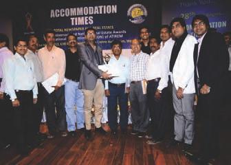 Ramesh Sanghvi Director Sanghvi Group, receiving the award from Shri Niranjan Hiranandani- MD Hiranandani constructions, Shri Azam Pansare State minister consumer welfare Govt.