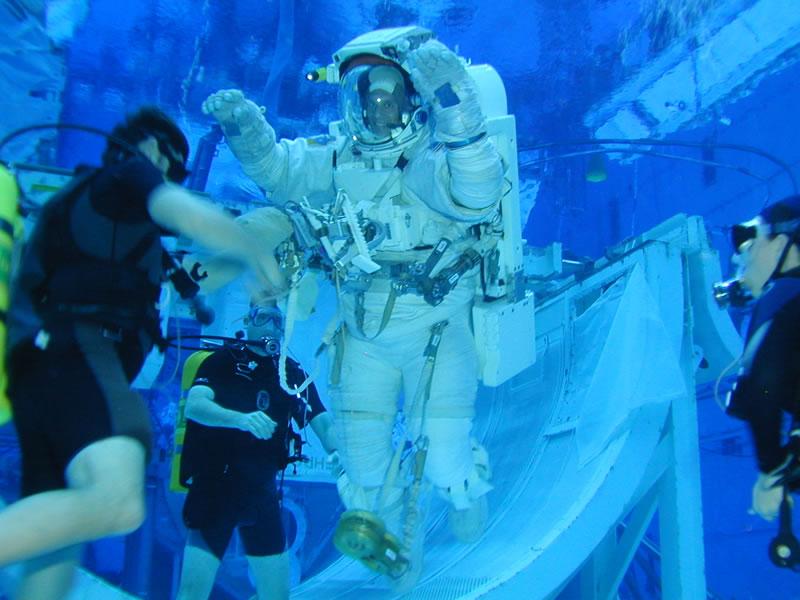 Neutral Buoyancy Laboratory Crews practice underwater to try and simulate zero gravity.