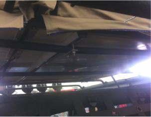 3. Attach the rooftop tent to your roof rack or roof bars in four places as