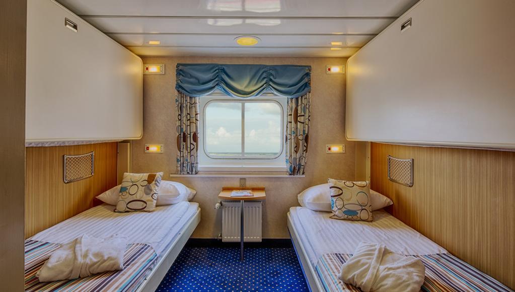 Located on the Upper Deck, it has exterior views and private facilities. UPPER DECK TWIN: Averaging 115 sq. ft. (10.6 sq.