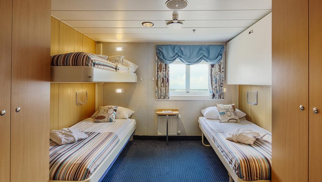 BRIDGE DECK TWIN: Averaging 105 sq. ft. (9.8 sq. m), a Bridge Deck Twin Cabin is equipped with two twin beds.