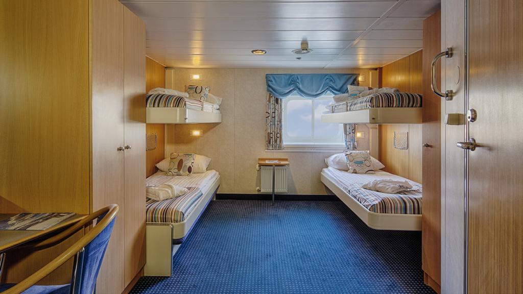 (8 sq. m), an Upper Lower Berth Cabin is equipped with one upper berth and one lower berth bed.