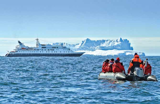 A Zodiac returns guests to the National Geographic Orion after an afternoon of exploring.