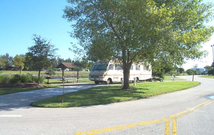Photo M-11. Pull-through site double. Ortona South Campground, Lake Okeechobee Waterway, FL.