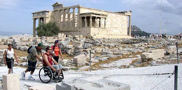 Ascent to the Acropolis by lift and wheelchair user viewing the Erechtheion (http://www.accessibletourism.org/resources/case-study-10-ec-athens-historical-centre-greece.
