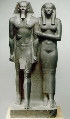Kouros and Kore, continued: notice in the Egyptian statue, spaces between arms and sides are filled by stone block and figure adheres to stone slab behind