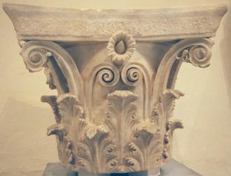 Greek Architecture: Corinthian Order: A Corinthian capital is in the shape of an inverted bell covered with curly shoots and leaves of
